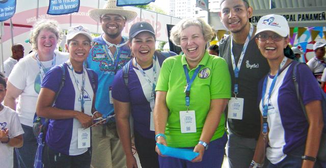 Lisa Buscher, RSCJ, (far left) and Mary Finlayson, RSCJ, (in green) welcoming pilgrims at the Vocation Fair of World Youth Day 2019, Panama.