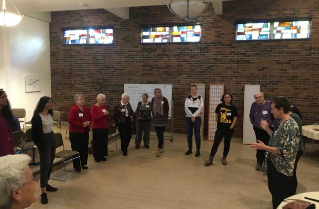 Sisters from several congregations, including RSCJ, gather with young women at the Stuart Center